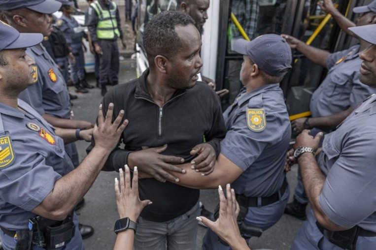 South African Police move migrants to Safety after facing Xenophobic Attacks