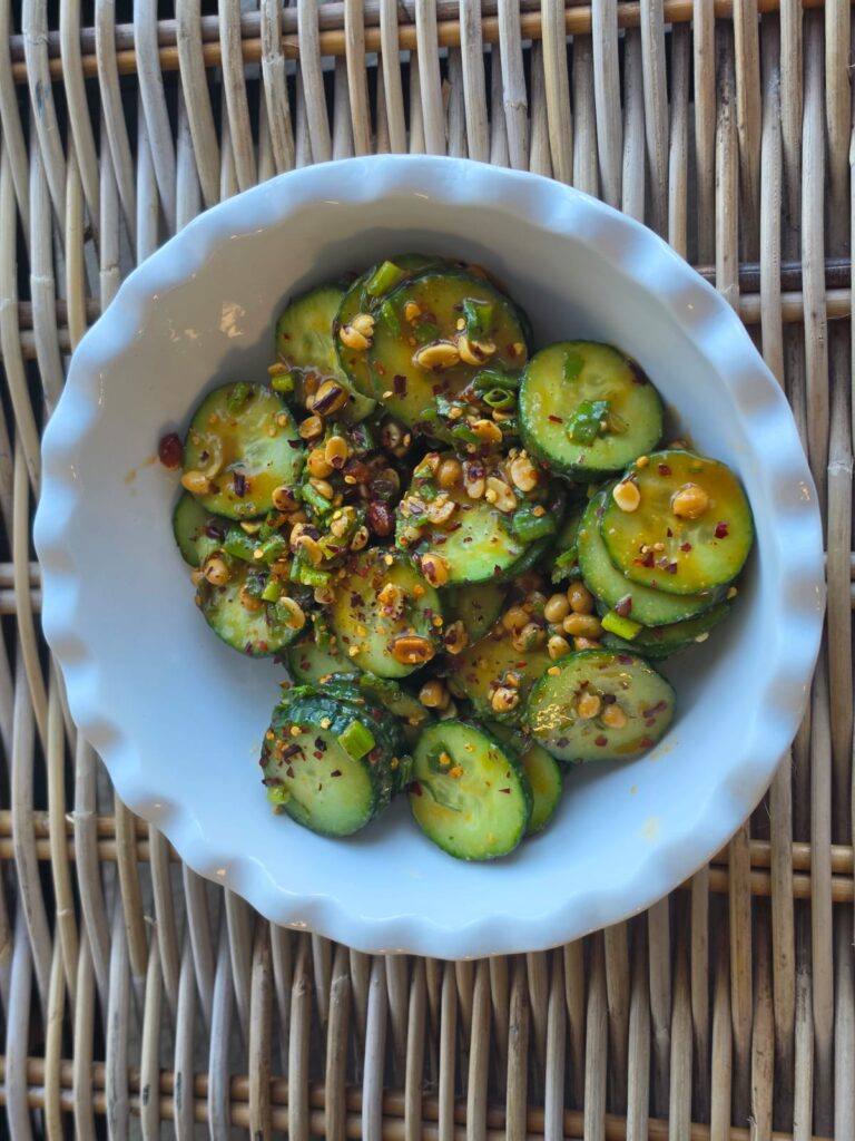 Sliced cucumber salad tossed with peanuts and peanut-soy dressing