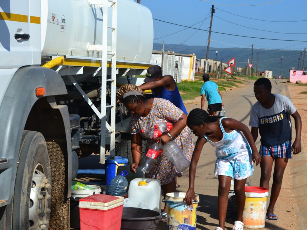 Residents collect water from a tanker during a water shortage in South Africa